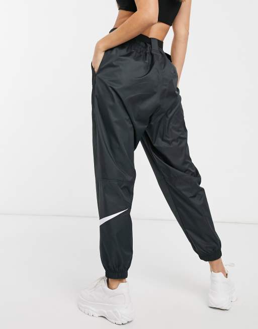 Nike woven swoosh store pant