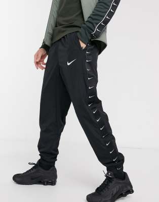 nike taped cuffed track pants