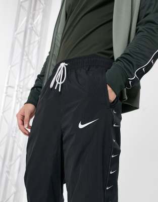 nike black swoosh woven joggers
