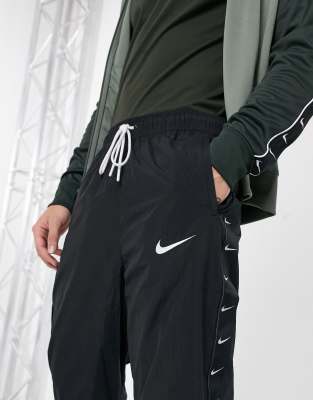 black nike taped joggers