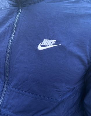 nike woven track top