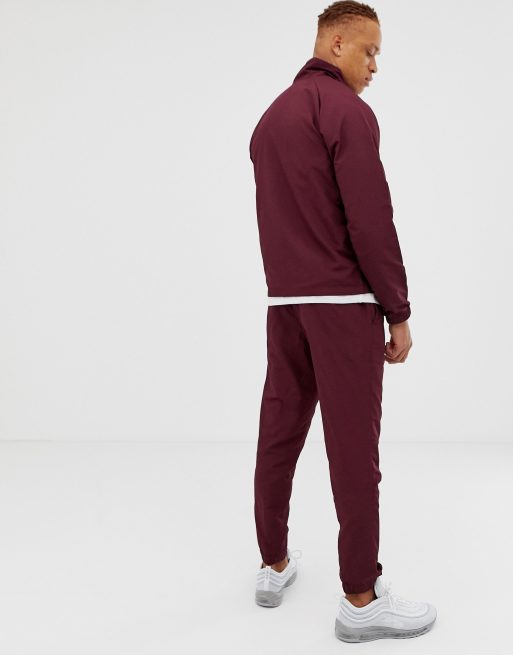 Nike woven tracksuit set in clearance red