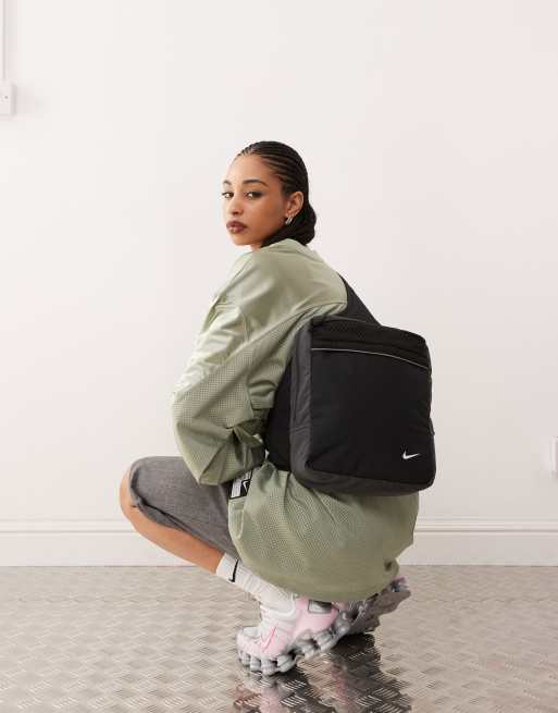 Nike x Tega large sling bag in black ASOS