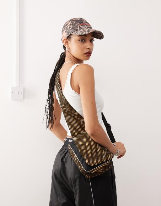 Nike x Tega SM sling bag in yellow ASOS