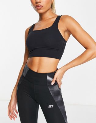 Nike Yoga Alate Eclipse strappy light support sports bra in black - ASOS Price Checker