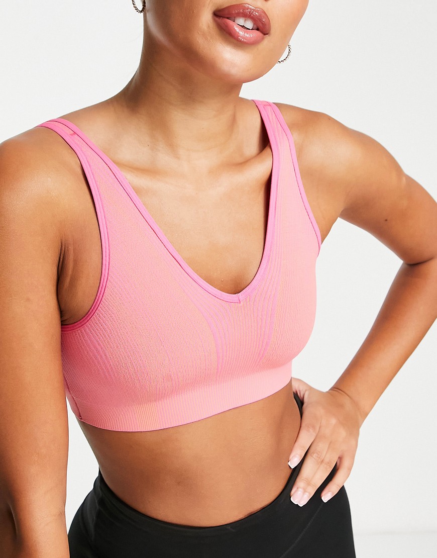 Nike Yoga Dri-FIT ADV Indy seamless light support sports bra in pink