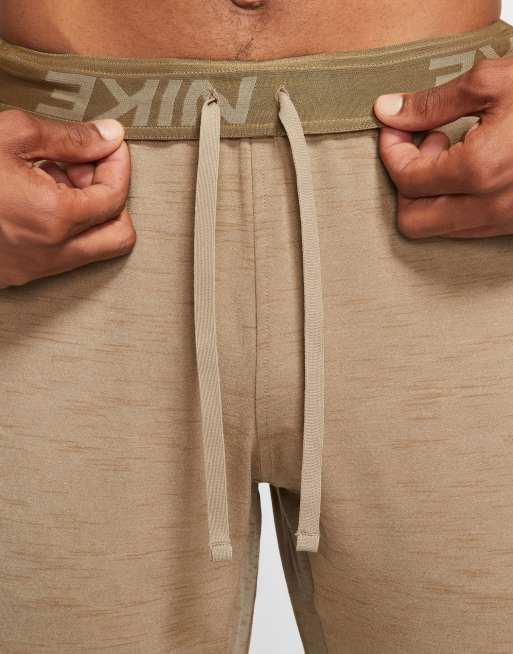 Nike Yoga Dri FIT cuffed sweatpants in sand CREAM ASOS