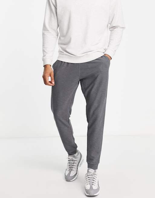 Nike Yoga Dri-FIT Essential Fleece cuffed sweatpants in gray | ASOS