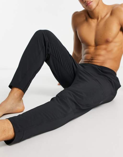 Nike Yoga Dri-FIT Flex sweatpants in black