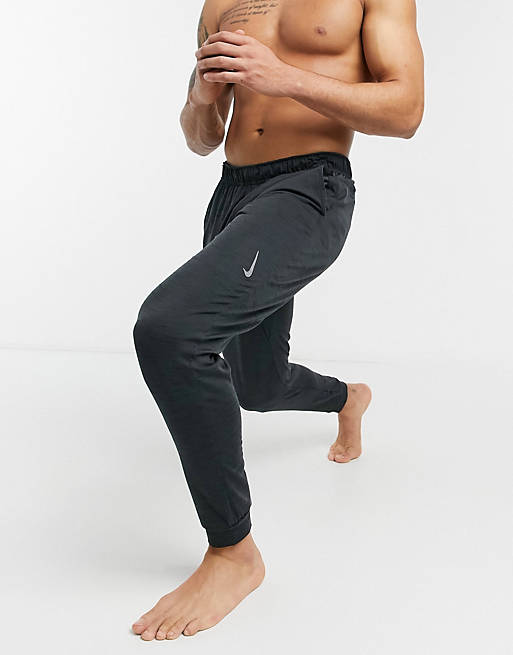 Nike Yoga Dri-FIT sweatpants in black - BLACK