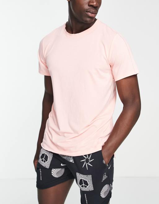 Nike Yoga - Festival - T-shirt rosa con stampa grafica sul retro