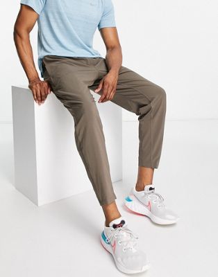 Nike Yoga Flex Dri-FIT trackies in brown - ASOS Price Checker