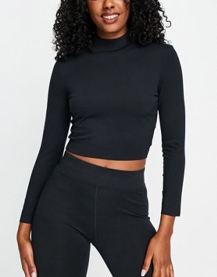 Nike Yoga Luxe Dri-FIT cropped long sleeve top in black | ASOS