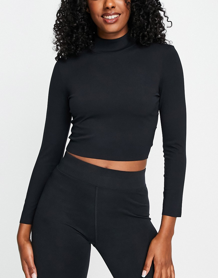 Nike Yoga Luxe Dri-FIT cropped long sleeve top in black