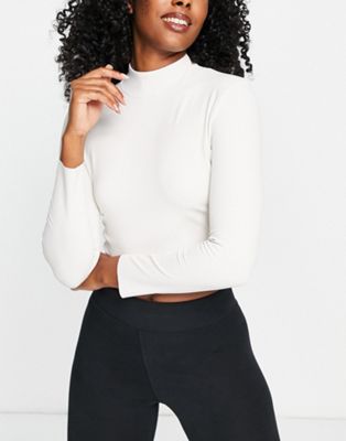 Nike Yoga Luxe Dri-FIT cropped long sleeve top in off white - ASOS Price Checker