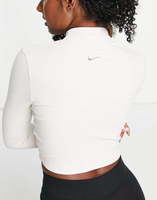 Nike Yoga Luxe Dri-FIT cropped long sleeve top in off white