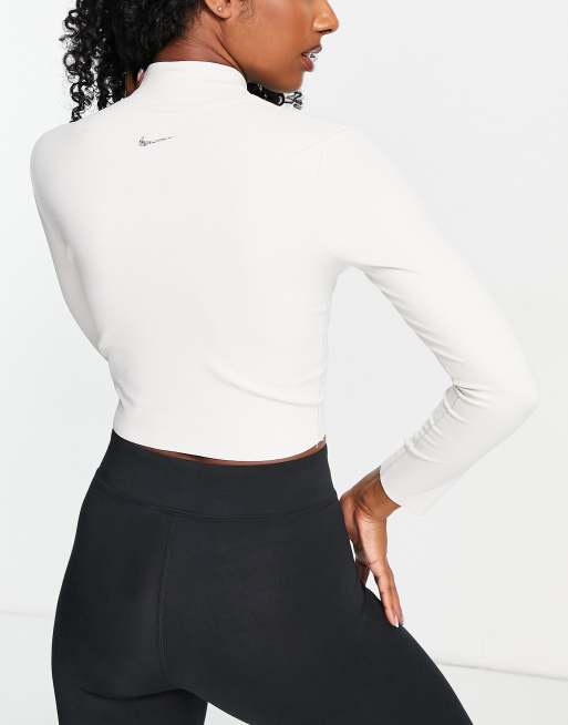 Nike Yoga Luxe Dri-FIT cropped long sleeve top in off white, ASOS