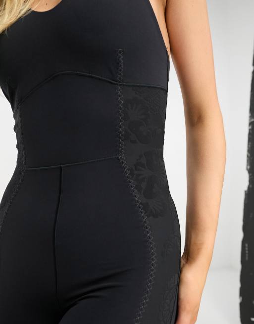 Køb Nike Dri-FIT Yoga Luxe Jumpsuit til Dame i Black/Dk Smoke Grey til 240  kr