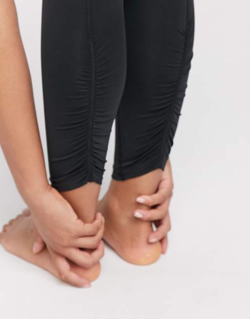 Nike Yoga ruched cropped leggings in black