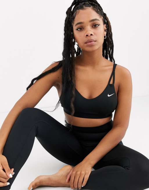 Nike Yoga strap detail bra in black | ASOS