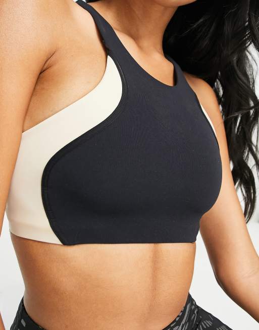 https://images.asos-media.com/products/nike-yoga-swoosh-dri-fit-cut-and-sew-mid-support-sports-bra-in-black/201544280-4?$n_640w$&wid=513&fit=constrain