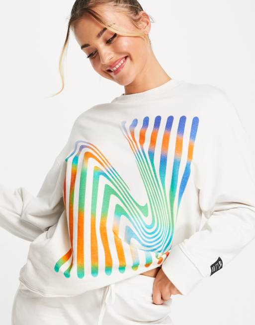 Nike Yoga Therma-FIT Luxe A.I.R. crew neck graphic sweatshirt in cream