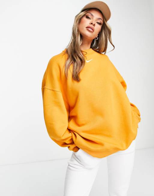 Niki - Oversized sweatshirt met ronde hals en mini swoosh in oranje 