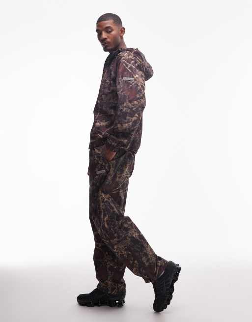No Problemo glitch nylon trouser co-ord in dark camo print, 2 of 5