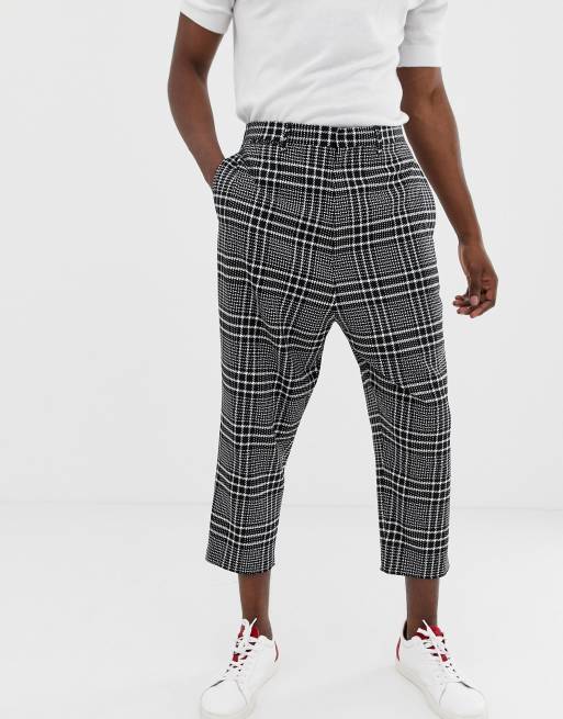 Noak drop crotch tapered cropped smart pants in black check | ASOS