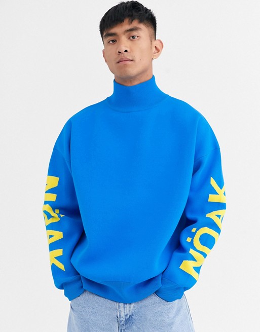 Noak high neck jumper in blue with branded sleeve