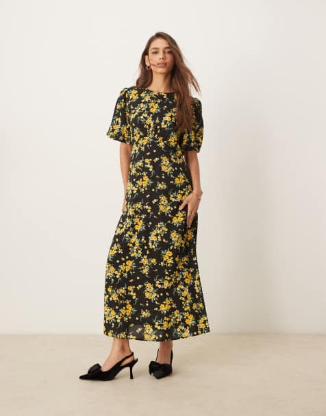 Nobody's Child - Benita - Midi jurk in zwart met fijne gele bloemenprint - view 1
