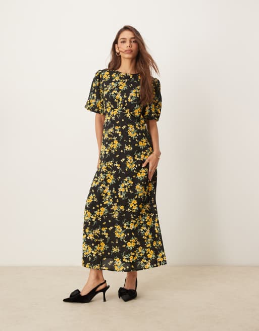 Nobody's Child - Benita - Midi jurk in zwart met fijne gele bloemenprint