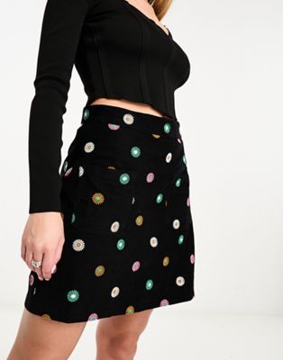 cord mini skirt with embrodery in black-Multi