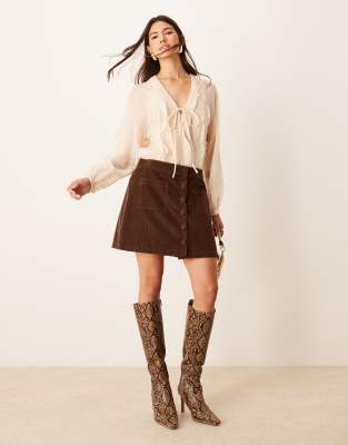 Lyon cord mini skirt with button front in brown