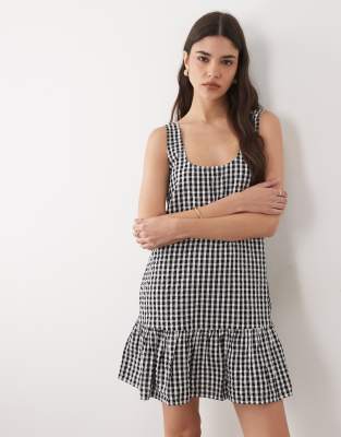 Millie - Robe courte et sans manches en coton vichy avec taille basse et ourlet volanté - Noir 6