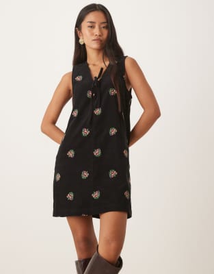 Nobody's Child Nila tie-detail corduroy pinafore mini dress in black embroidery