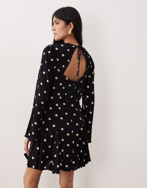 Nobody's Child Paris cut out back fluted hem mini dress in black polka dot