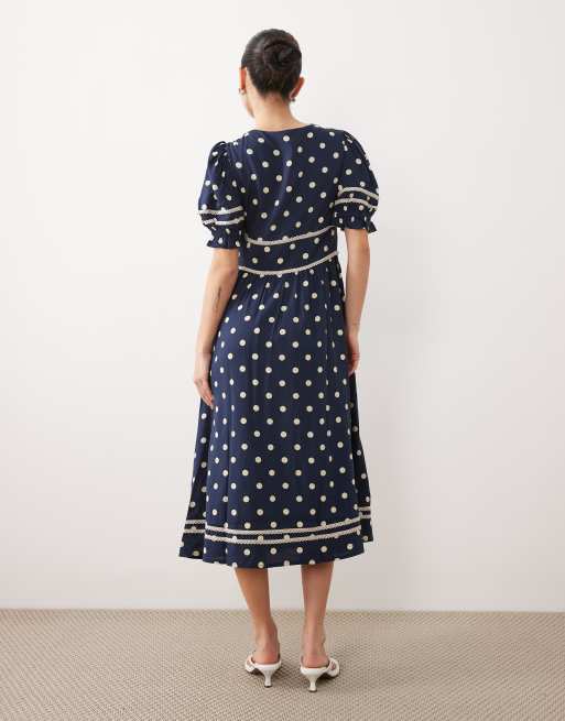 Nobody's Child Petite Saffy bell sleeve polka-dot midi dress in navy | ASOS