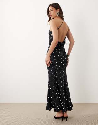 Pia - Robe longue habillée asymétrique en satin à pois avec col bénitier et dos ouvert - Noir 32