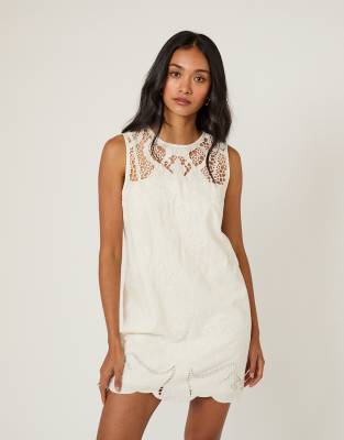Sonia - Robe courte sans manches en coton mélangé avec détail en broderie anglaise - Blanc 38