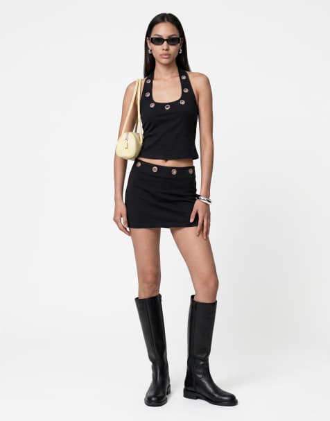 Noisy May - Conjunto negro de top de cuello halter con ojales y minifalda de talle medio con ojales - view 1