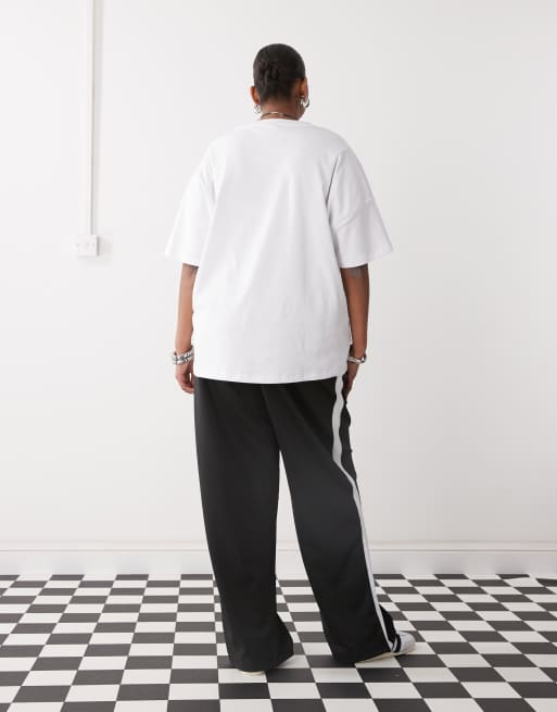 Noisy May Curve – Jogginghose in Schwarz mit weitem Bein und Seitenstreifen, 2 von 5