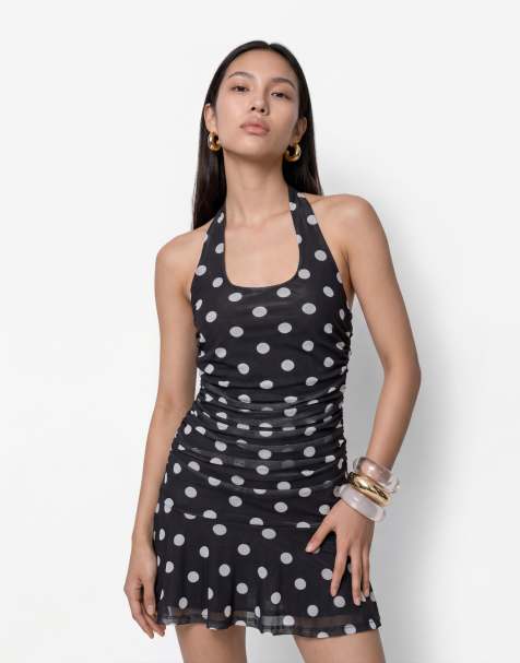 Noisy May – Czarna sukienka mini z dekoltem halter w groszki - view 1