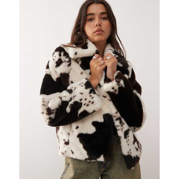 Noisy May faux fur coat in cow print | ASOS