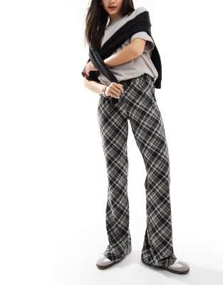 flared pants in black plaid