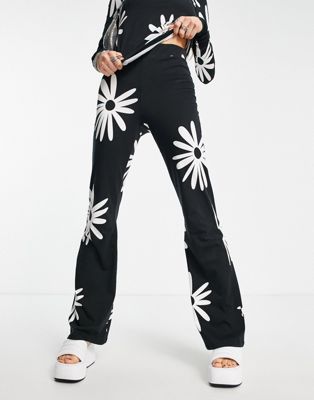 Noisy May exclusive flared trousers co-ord in black daisy print