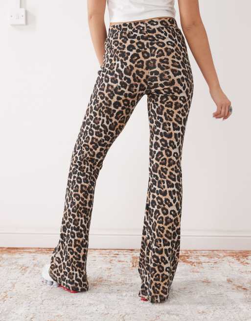 Stretchy denim green leopard print side stripe jeggings featuring