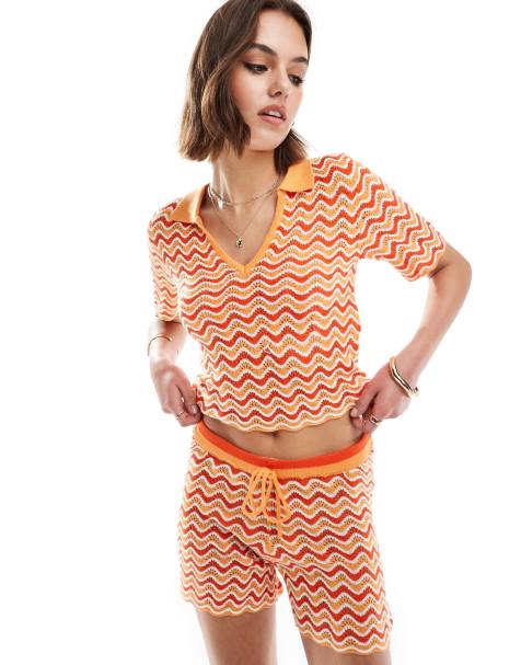 Noisy May - Gebreid poloshirt in golvend oranje, deel van co-ord set - view 1