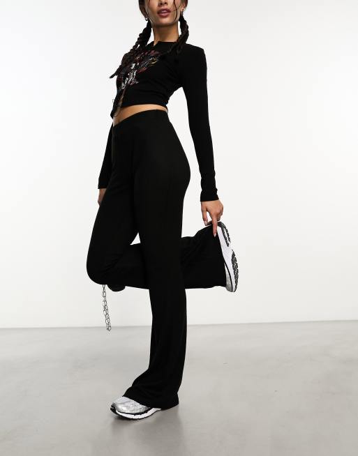 Noisy May - Gebreide flare-broek met hoge taille in zwart