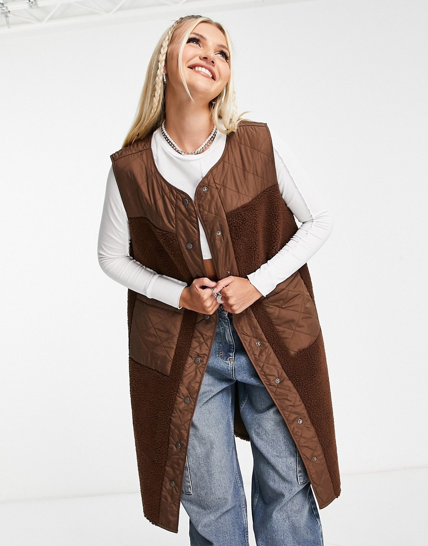 Noisy May longline mixed quilted and teddy gilet in brown
